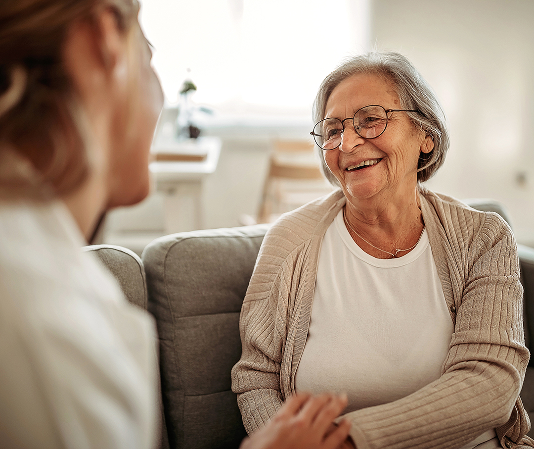 Female doctor consulting her senior patient